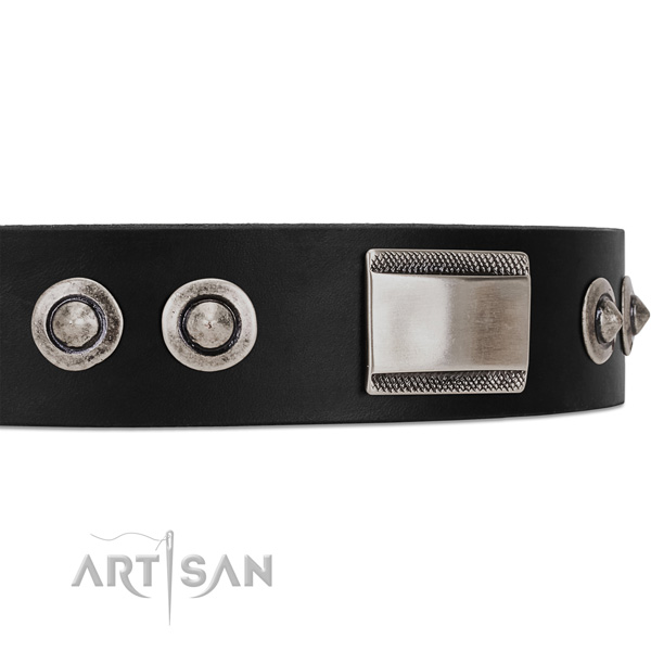 Black dog collar with large plates and spiked studs