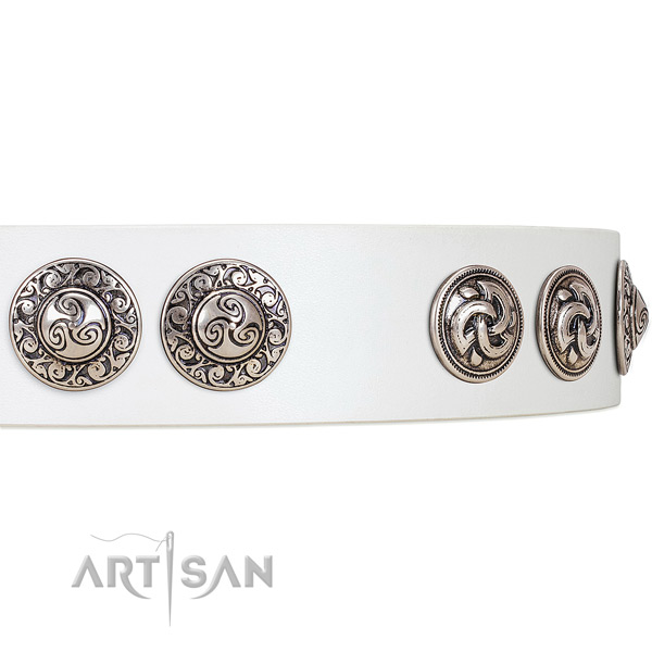 Striking white leather dog collar with engraved
medallions