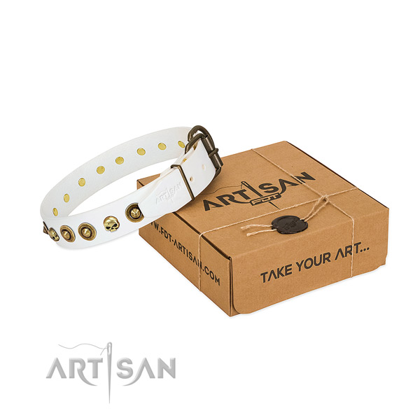 Handmade white leather dog collar adorned with exclusive
decorations